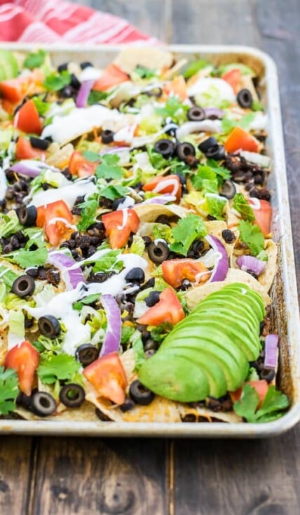 black bean nachos recipe on a sheet pan ready to eat