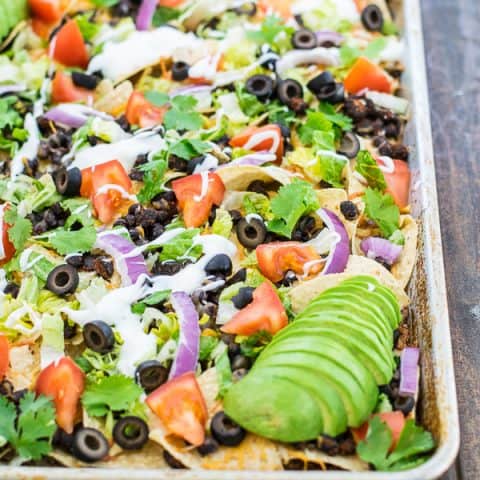 black bean nachos recipe on a sheet pan ready to eat