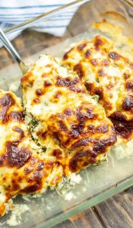 a piece of cheesy chicken in the baking dish