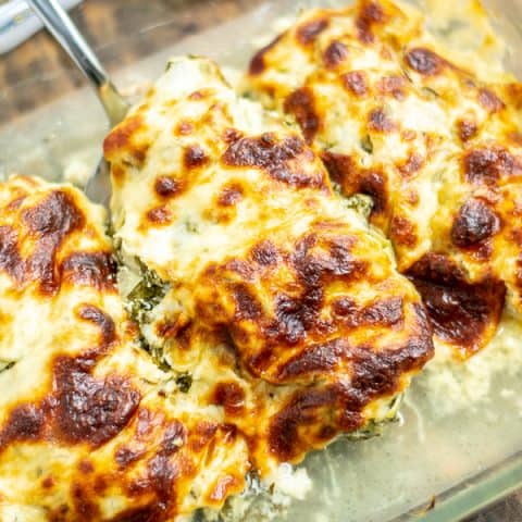 a piece of cheesy chicken in the baking dish