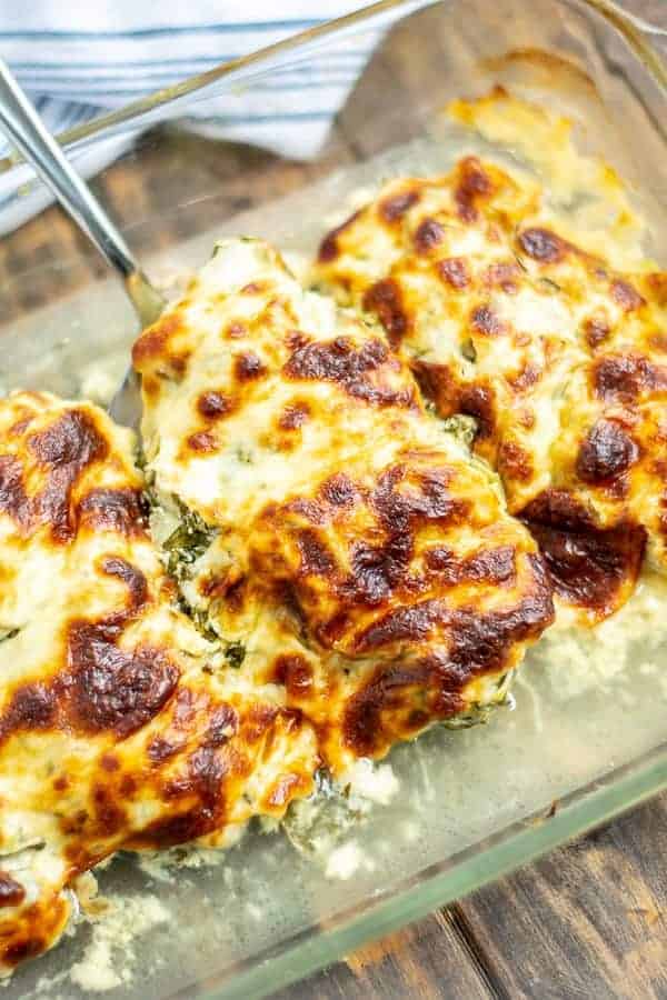 a piece of cheesy chicken in the baking dish