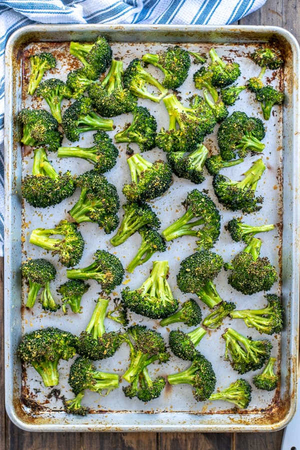freshly cooked broccoli on a sheet pan - Roasted Broccoli Recipe | Oven Roasted Broccoli Recipe | Best Oven Roasted Broccoli Recipe |Roasted Broccoli Recipes Healthy | Recipe for roasted Broccoli in the Oven