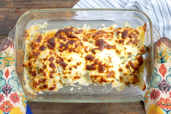 spinach artichoke chicken bake pulled just out of the oven