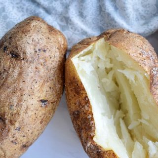 baked potato sliced open showing white insides