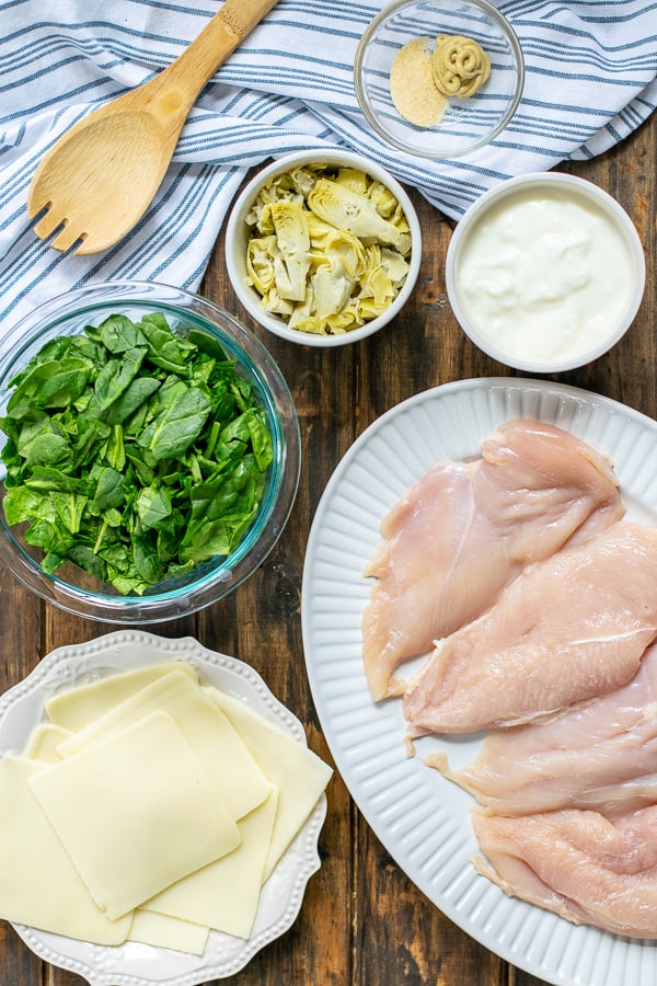 all of the ingredients needed for spinach artichoke chicken bake 