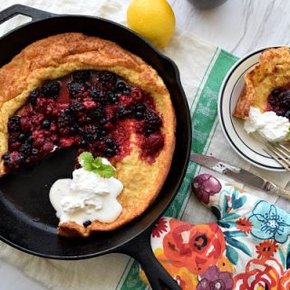 Lemon Dutch Baby with Berry Compote and Whipped Cream
