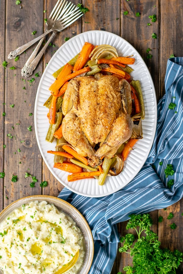 a meal with roast chicken on a table 