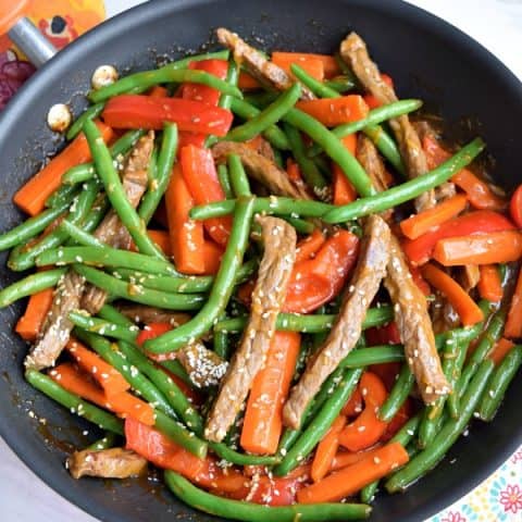 orange-ginger beef stir fry with carrots, red bell pepper, and green beans
