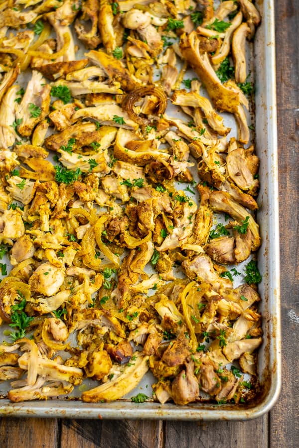 shredded chicken shawarma on a sheet pan