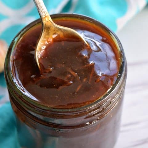 a jar of homemade teriyaki sauce with a spoon