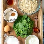 all of the ingredients need to make the pancakes on a wood tray