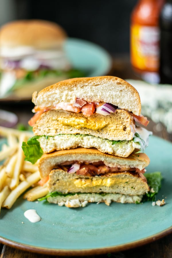 stuffed buffalo chicken burger cut in half and stacked to show filling coming out