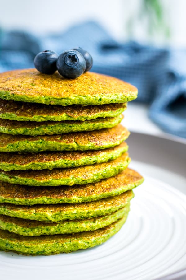 close up of a stack of spinach oatmeal pancakes