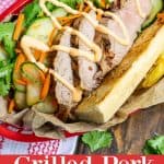 a pork banh mi served with French fries and sriracha mayo