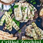 a spread of grilled zucchini, eggplant, naan, and hummus