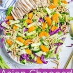grilled chicken on top of an asian chopped salad