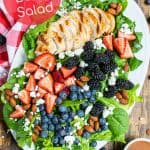 platter full of berry salad with spinach on a platter