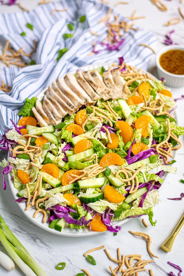 Asian Cabbage Salad on a white table with a sesame vinaigrette