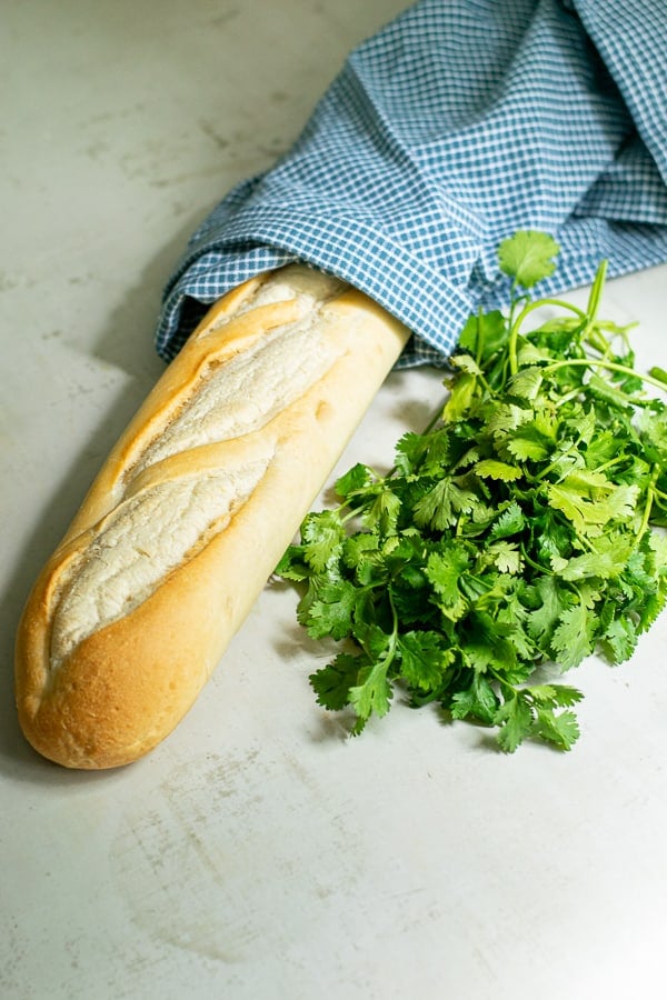 a baguette and a bunch of cilantro for the sandwiches