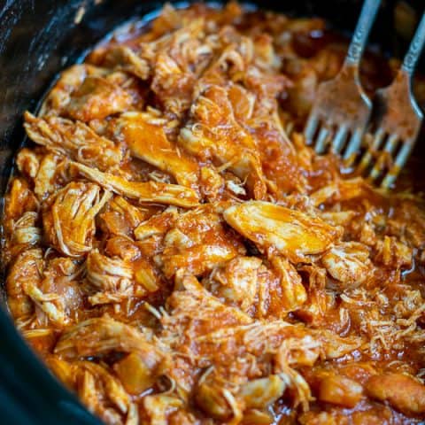 close up of pulled bbq chicken in the slow cooker