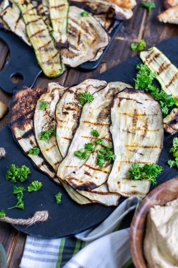 grilled eggplant ribbons on a black plate