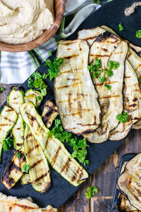 grilled zucchini and eggplant on a black platter for serving