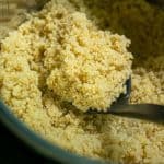 spoon full of freshly cooked pressure cooker quinoa