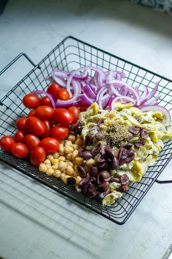 ingredients for chickpea salad in a basket for the grill