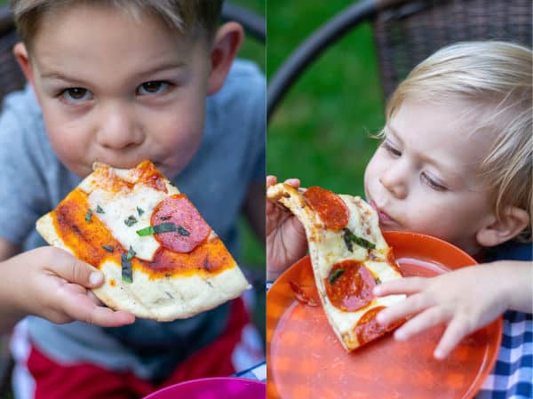 kids enjoying fresh made pepperoni grilled pizza