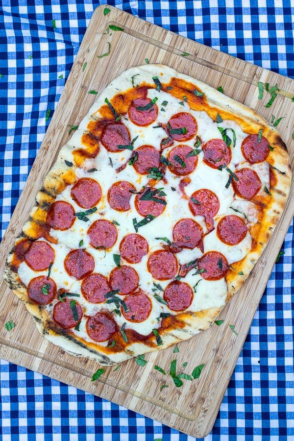overhead photo of a whole pepperoni grilled pizza