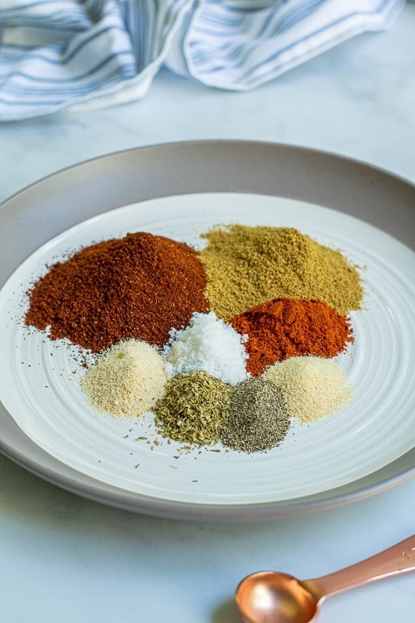 plate full of little piles of the spices used to make this taco seasoning simple