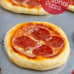 individual pizza on a sheet pan freshly bakes in the oven
