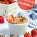 easy chocolate hummus in a white bowl with strawberries
