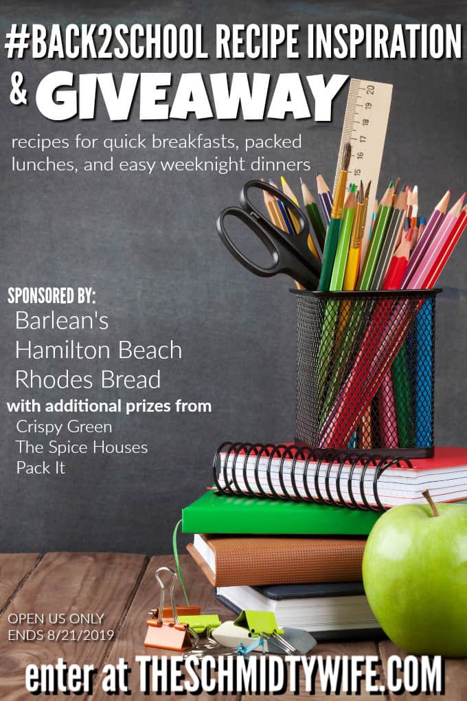 School and office supplies and apple on classroom table in front of blackboard. View with copy space