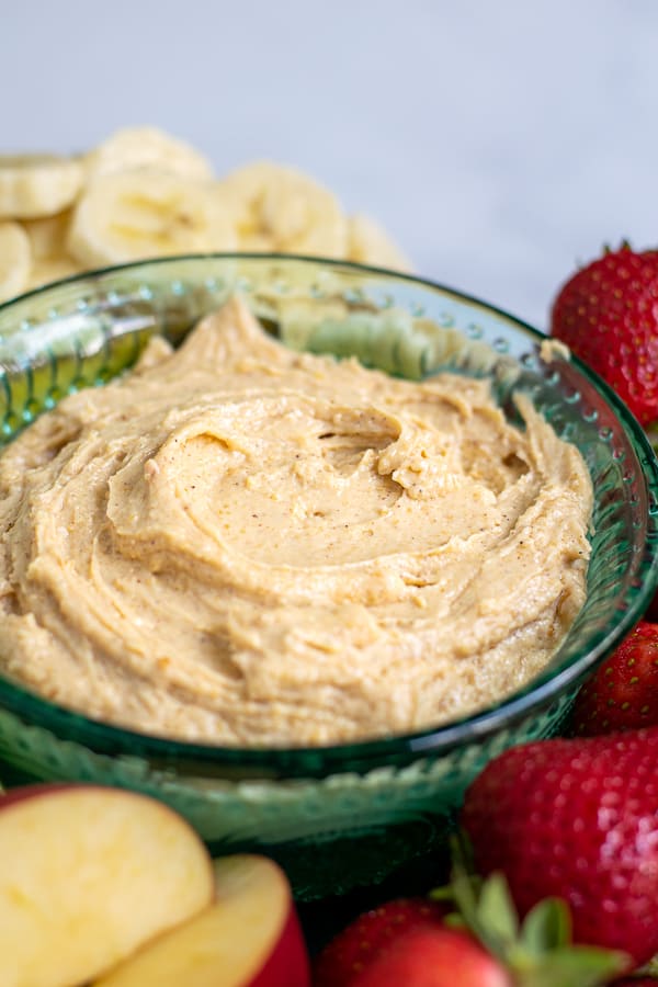 blue bowl filled with whipped peanut butter dip for fruit