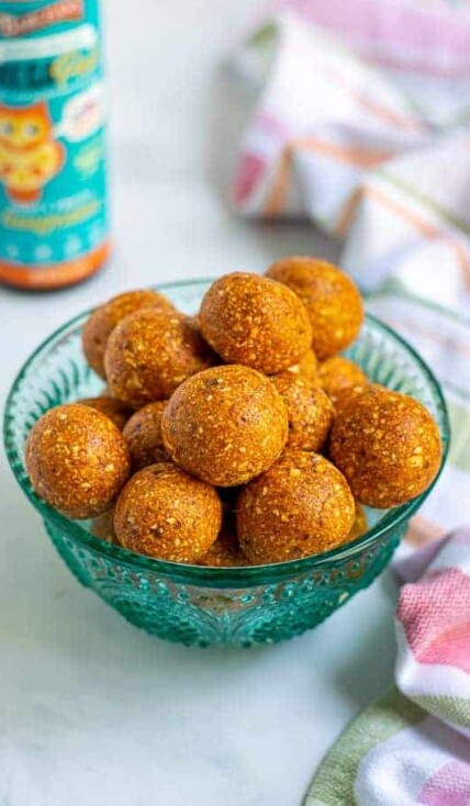 a blue bowl full of easy tropical energy bites