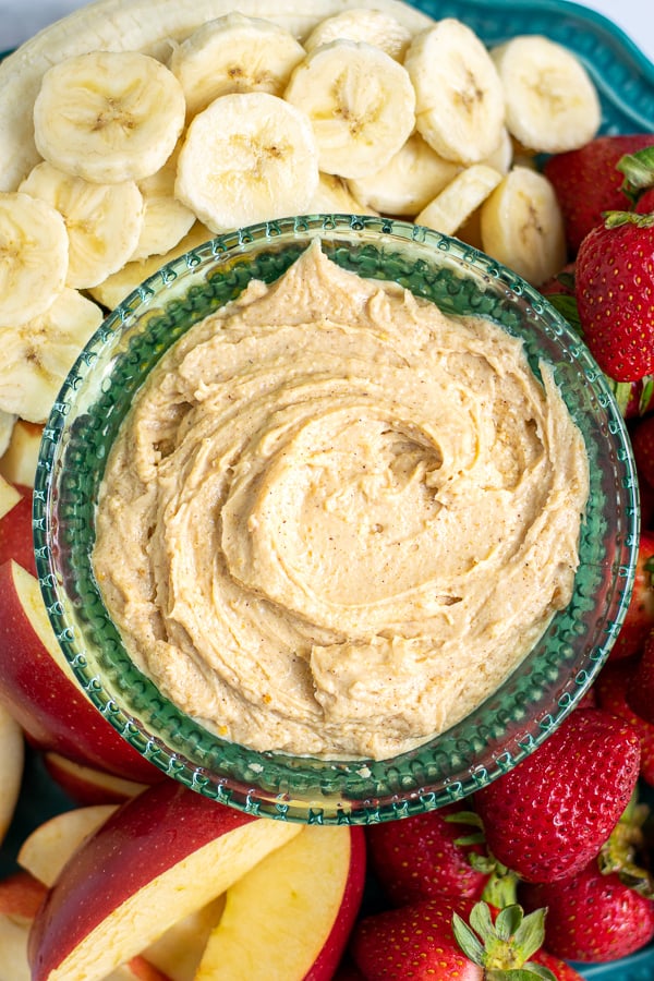 overhead view of a bowl of healthy peanut butter fruit dip