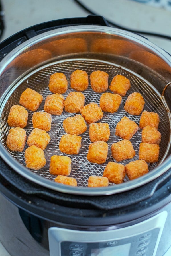 food in the air fryer basket before being cooked