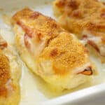 close up of breadcrumbs on top od a chicken cordon bleu in a baking dish
