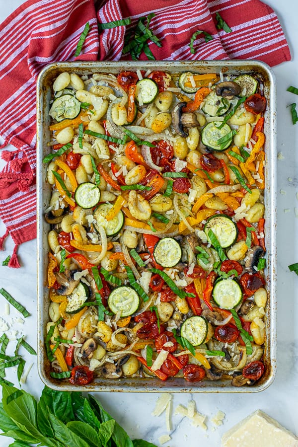 baked gnocchi and roasted vegetables on a sheet pan 