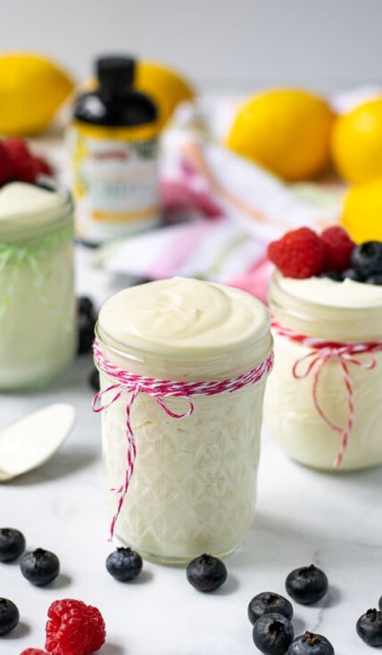 light and airy lemon whipped greek yogurt in a jar with a pink string.