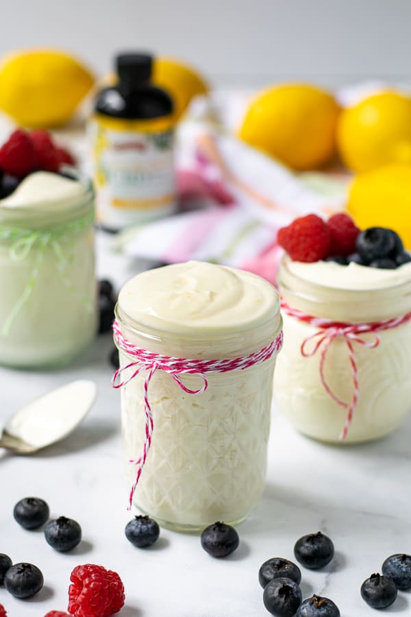light and airy lemon whipped greek yogurt in a jar with a pink string.