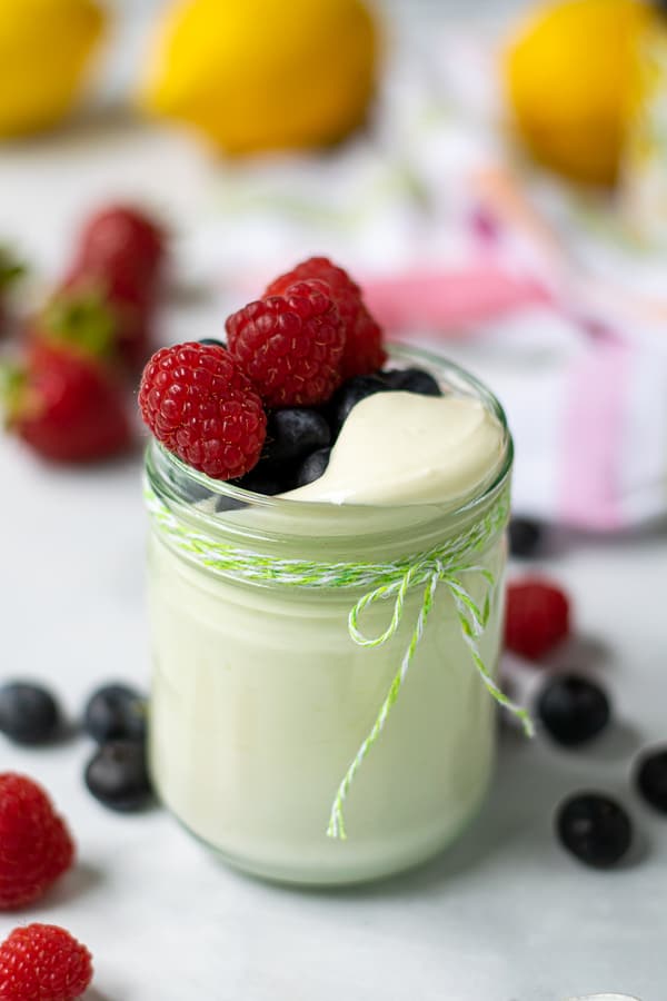 jar full of whipped greek yogurt and berries