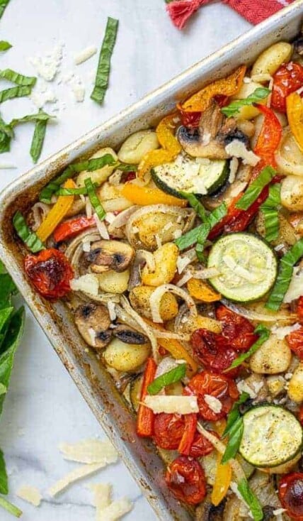 corner of a baked gnocchi and vegetables sheet pan meal