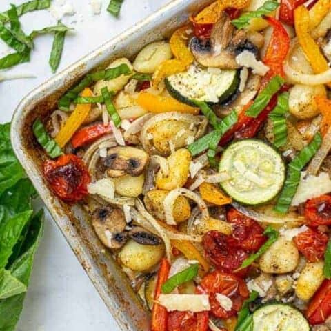 corner of a baked gnocchi and vegetables sheet pan meal