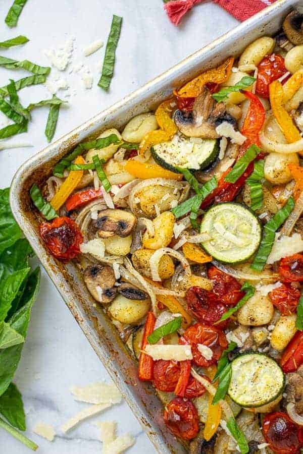 corner of a baked gnocchi and vegetables sheet pan meal