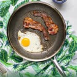 Pinterest pin for the non-stick frying pan featuring a skillet with bacon and eggs