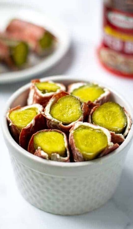 white bowl full of dried beef pickle roll ups