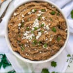 instant pot refried beans in a bowl with spoons