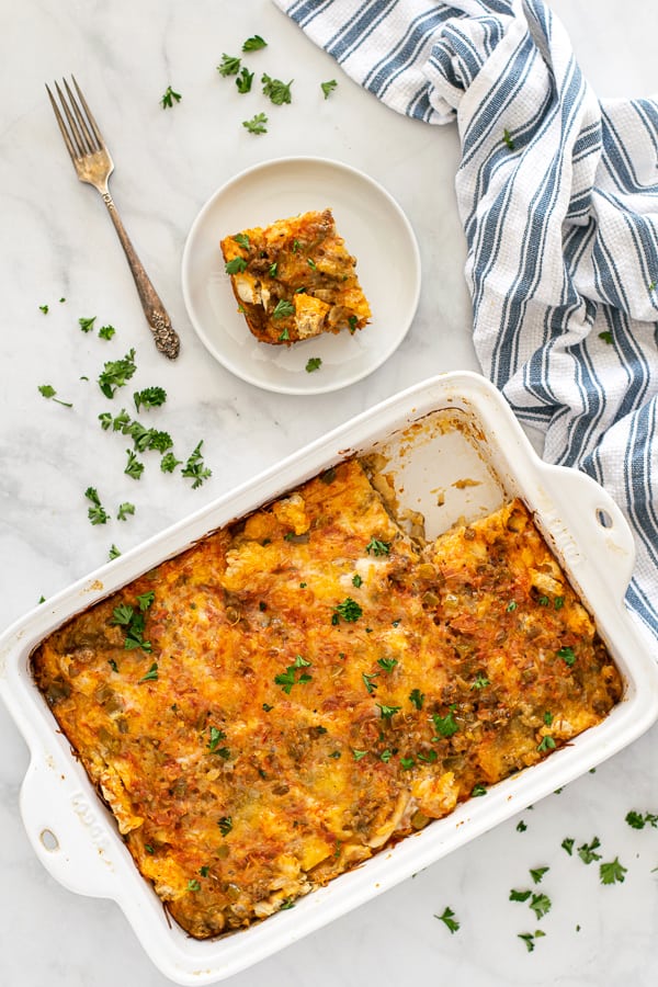 overhead view of the tex-mex breakfast casserole with a piece taken out on a plate